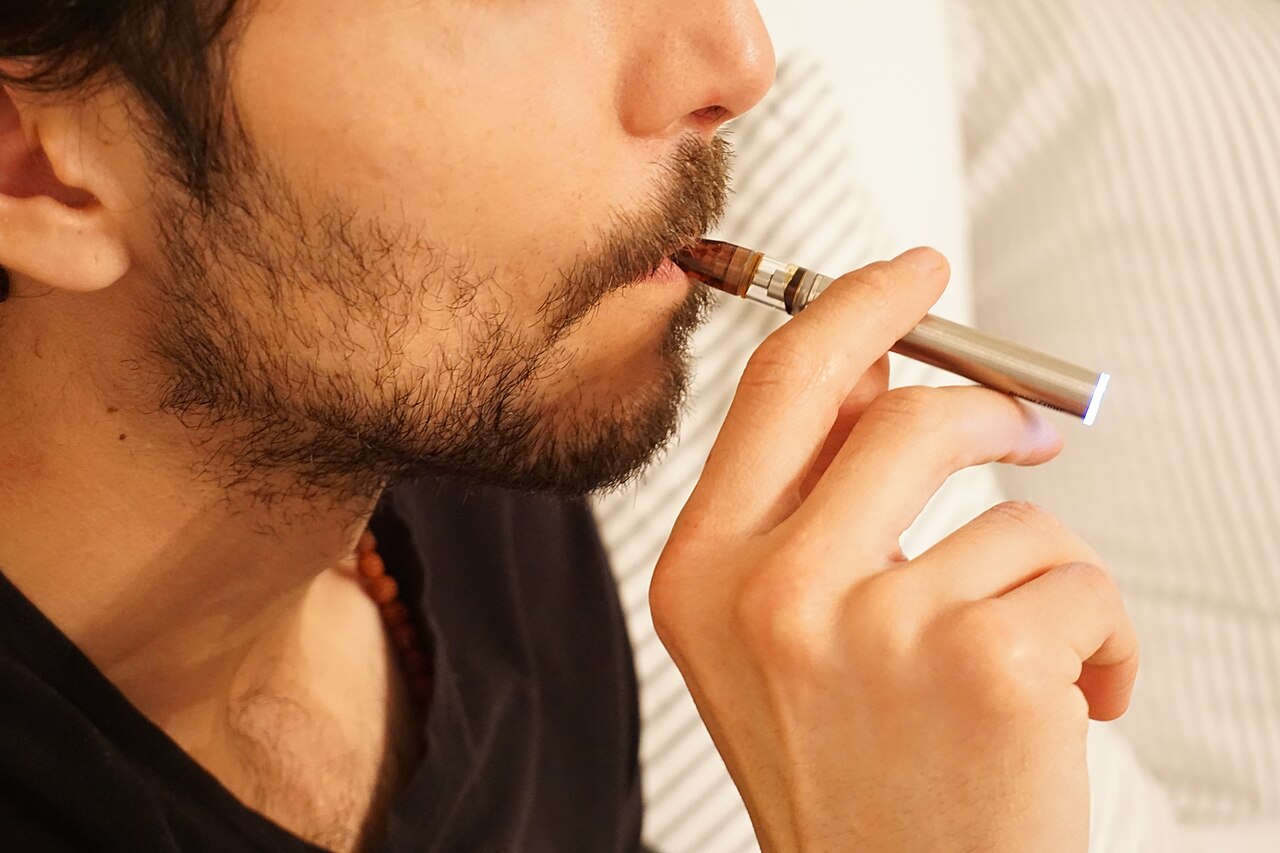 Person using a vape pen